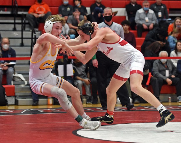 Marist's Will Denny, right, gets tangled up with Sandburg's Sammie Hayes at 120 pounds in the Class 3A Hinsdale Central Sectional on Saturday, Feb. 12, 2022.