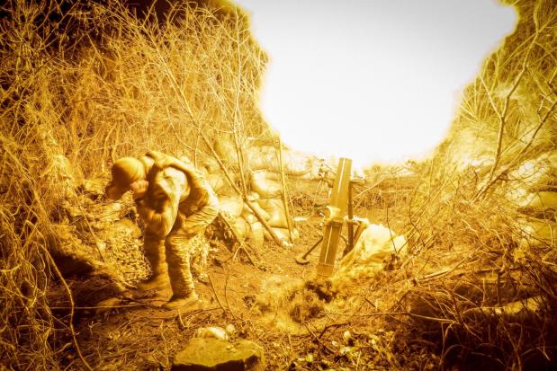 In this photo provided by Ukraine's 24th Mechanised Brigade press service, servicemen of the 24th Mechanised Brigade fire 120mm mortar towards Russian positions near Chasiv Yar town, in Donetsk region, Ukraine, Tuesday, Nov. 19, 2024. (Oleg Petrasiuk/Ukrainian 24th Mechanised Brigade via AP)