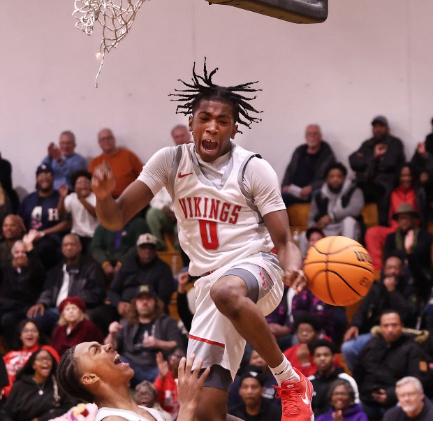 Homewood-Flossmoor's Jayden Tyler reacts after a dunk against Bloom during the championship game of the Chicago Heights Classic on Friday, Nov. 29, 2024. (John Smierciak / Daily Southtown)