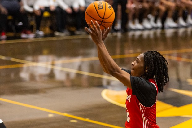 Marist's Torrence Tate (2) puts up a three against Shepard during the Andrew/Lincoln-Way Central Tournament in Tinley Park on Tuesday, Nov. 26, 2024. (Vincent D. Johnson / for the Daily Southtown)