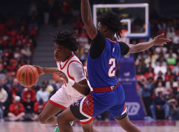 Homewood-Flossmoor point guard Jayden Tyler (0) races around Curie guard Carlos Harris (2) during the Class 4A UIC Supersectional at Credit Union 1 Arena in Chicago on Monday, March 4, 2024. (Trent Sprague/for the Daily Southtown)