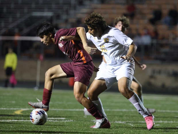 Brother Rice's Angelo Piech (10) and Oak Forest's Jacob Barrera (16) battle for control of the ball during the Class 2A Brother Rice Sectional semifinal at Brother Rice High School in Chicago on Wednesday, Oct. 30, 2024. (Talia Sprague / Daily Southtown)