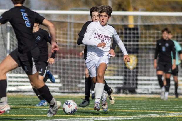 Lockport's Aleko Kolliniatis (3) dribbles down field against Lincoln-Way East during the Class 3A Joliet West Sectional final game in Joliet on Saturday, Nov. 2, 2024. (Troy Stolt / for the Daily Southtown)