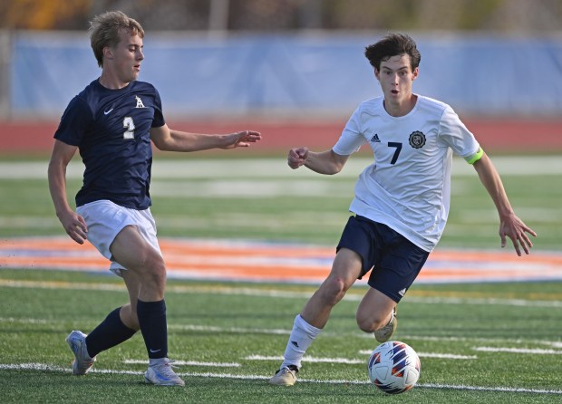 Lemont's Tyler Chrisman (7) gets by Belleville Althoff's Jack Sorgea (3) during the 1st half of Friday's IHSA Class 2A semifinal, Nov. 8, 2024. Belleville Althoff won the game, 1-0. (Brian O'Mahoney for the Daily Southtown)