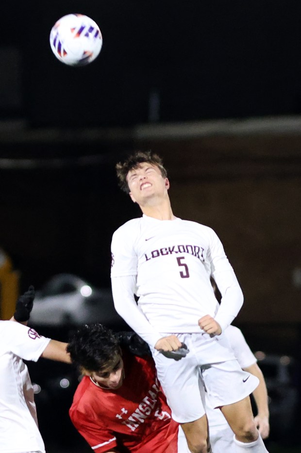 Lockport's Sebastian Gryglak heads the ball as Hinsdale Central's Michael DiTomasso defends during the Class 3A Morton Supersectional soccer game in Berwyn on Tuesday, Nov. 5, 2024. (James C. Svehla / for the Daily Southtown)