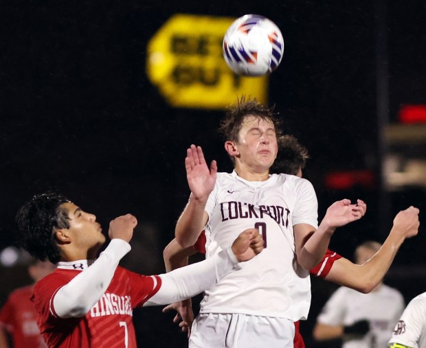 Lockport's Jacob Hareza heads the ball as Hinsdale Central's Enzo Cinque, left, defends during the Class 3A Morton Supersectional soccer game in Berwyn on Tuesday, Nov. 5, 2024. (James C. Svehla / for the Daily Southtown)