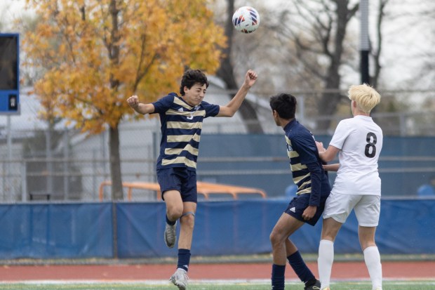 Lemont's Vincenzo Mancini (3) goes up for a header against Prairie Ridge during the IHSA Class 2A third-place game in Hoffman Estates on Saturday, Nov. 9, 2024. (Troy Stolt / for the Daily Southtown)