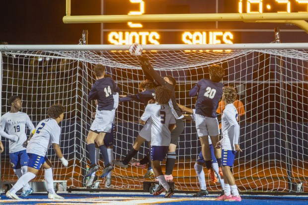 De La Salle's Gianni Luque (0) makes a save against Althoff Catholic during the IHSA Class 2A state championship game in Hoffman Estates on Saturday, Nov. 9, 2024. (Troy Stolt / for the Daily Southtown)