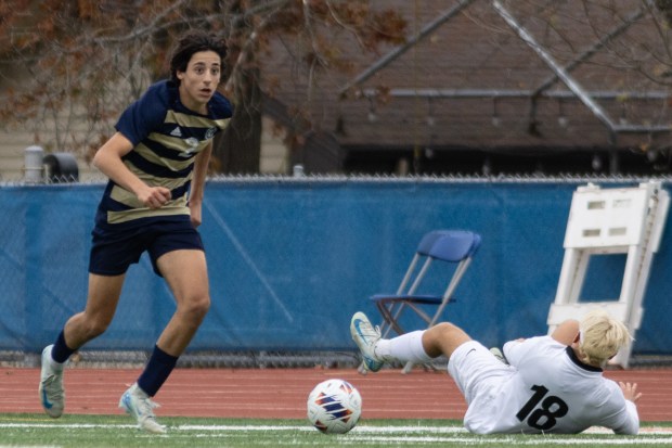 Lemont's Luciano Mancini (2) gains possession of the ball against Prairie Ridge during the IHSA Class 2A third-place game in Hoffman Estates on Saturday, Nov. 9, 2024. (Troy Stolt / for the Daily Southtown)