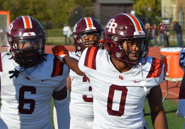 Brother Rice's Donovan Brown, left, celebrates with Ryan Lynch after an interception against Fenwick during a Class 7A first-round playoff game at Triton College in River Grove on Saturday, Nov. 2, 2024. (Jeff Vorva / Daily Southtown)