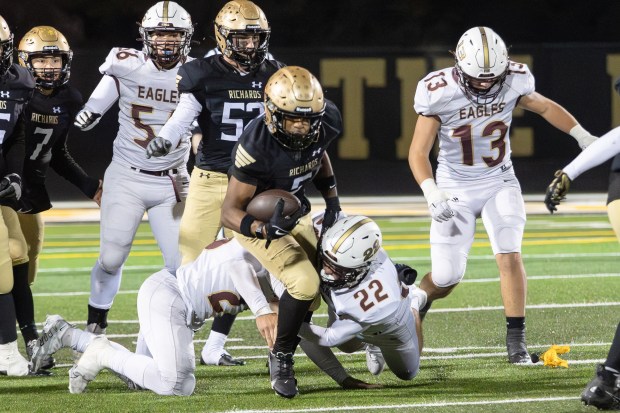 Richards's Myles Mitchell (5) dives for a first down against Dunlap during a Class 6A first-round game in Oak Lawn on Friday, Nov. 1, 2024. (Troy Stolt / for the Daily Southtown)