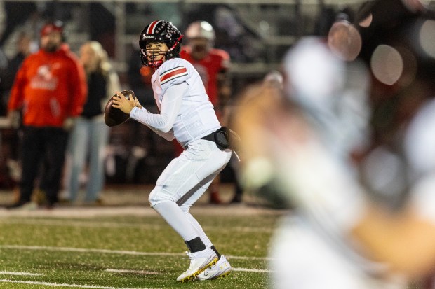 Lincoln-Way Central's Drew Woodburn (4) steps back to pass against Bradley-Bourbonnais Class 7A state quarterfinals in Bradley on Friday, Nov. 15, 2024. (Vincent D. Johnson / for the Daily Southtown)