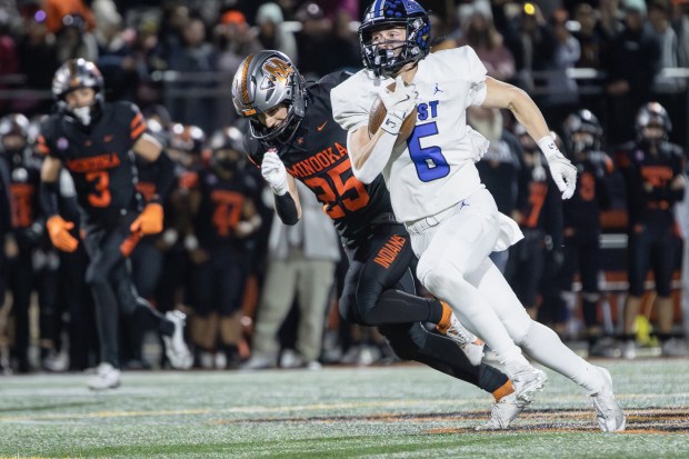 Lincoln-Way East's Keagan Ruane (6) scores a touchdown against Minooka during a Class 8A second-round game in Minooka on Friday, Nov. 8, 2024. (Troy Stolt / for the Daily Southtown)