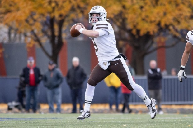 Mount Carmel's Jack Elliott (9) throws the ball against St. Rita during a Class 7A state semifinal game in Chicago on Saturday, Nov. 23, 2024. (Troy Stolt / for the Daily Southtown)