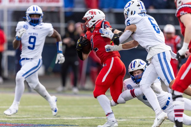 St. Rita's Nick Herman (2) gets past a pair of Quincy defenders in the Class 7A state quarterfinals in Chicago on Saturday, Nov. 16, 2024. (Vincent D. Johnson / for the Daily Southtown)