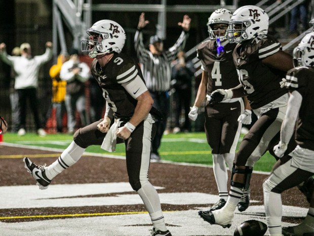 Mount Carmel's Jack Elliott (9) erupts in celebration after scoring the Caravan's first touchdown against St. Charles North during the Class 7A second-round game in Chicago on Saturday, Nov. 9, 2024. (Vincent D. Johnson / for the Daily Southtown)