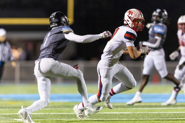 St. Rita's Thomas Perry (9) turns upfield after a reception as Willowbrook's Otis Powell (1) tries to tackle him in the Class 7A second-round game in Villa Park on Friday, Nov. 8, 2024. (Vincent D. Johnson / for the Daily Southtown)