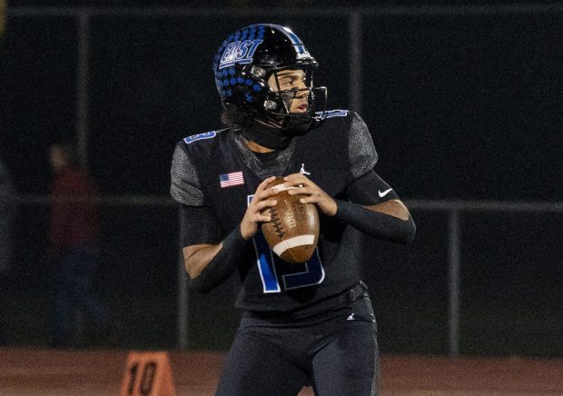 Lincoln-Way East's Jonas Williams (13) looks to throw the ball during the Class 8A state quarterfinal game against Stevenson on Friday, Nov. 15, 2024, at Lincoln-Way East High School in Frankfort, Ill. (Vincent Alban / Daily Southtown)