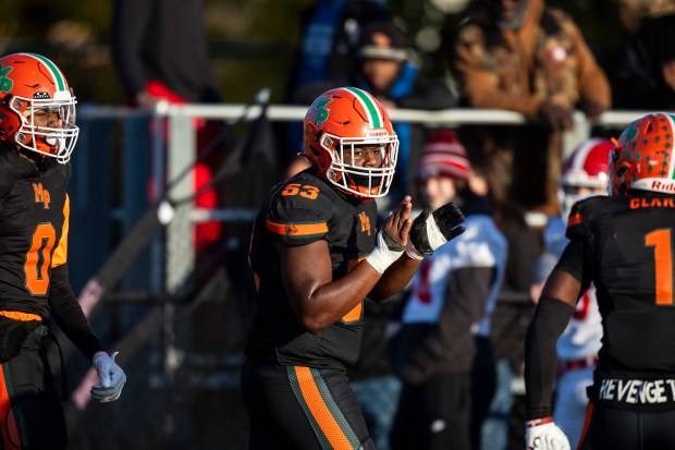 Morgan Park's Geordan Pettie (53) claps after a big defensive play against Tinley Park during the Class 5A first-round game at Gately Stadium in Chicago on Saturday, Nov. 2, 2024. (Vincent D. Johnson / for the Daily Southtown)