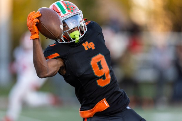 Morgan Park's Pierre Jackson jr. (9) bobbles a pass against Tinley Park during the Class 5A first-round game at Gately Stadium in Chicago on Saturday, Nov. 2, 2024. (Vincent D. Johnson / for the Daily Southtown)