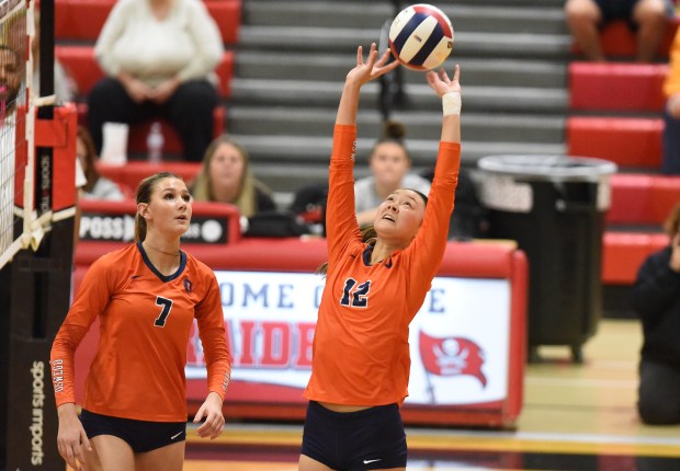 Oswego's Ava Flanigan (12) sets the ball against Joliet West during the Class 4A Bolingbrook Sectional semifinals Tuesday, Nov. 5, 2024 in Bolingbrook, IL. (Steve Johnston/for the The Beacon-News)