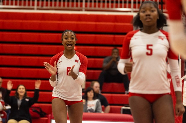 Homewood-Flossmoor's Kymora Scott (8) celebrates after getting a kill against Sandburg during the Class 4A Homewood-Flossmoor Regional final in Flossmoor on Thursday, Oct. 31, 2024. (Vincent D. Johnson / for the Daily Southtown)