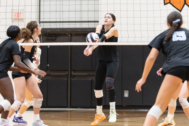 Lincoln-Way West's Caroline Smith (5) digs the ball against Joliet Catholic during the Class 4A Lincoln-Way West Regional final in New Lenox on Thursday, Oct. 31, 2024. (Troy Stolt / for the Daily Southtown)