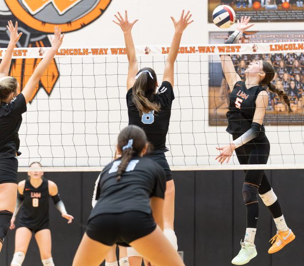 Lincoln-Way West's Caroline Smith (5) spikes the ball against Joliet Catholic during the Class 4A Lincoln-Way West Regional final in New Lenox on Thursday, Oct. 31, 2024. (Troy Stolt / for the Daily Southtown)