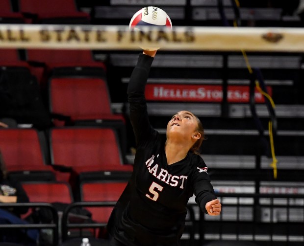 Marist's Elayna Davidson (5) serves. Marist came from behind to defeat Benet Academy 19-25, 25-26, 25-19 to win the first place trophy in the IHSA Class 4A state tournament Championship game at the CEFCU Arena on the campus of Illinois State University in Normal, Nov. 15, 2024 (Rob Dicker / for Pioneer Press)