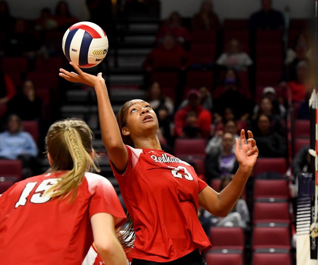 After hitting a slam over the net, Benet Academy's Brooklynne Brass (23) quickly reacts after the ball was gets blocked right back to her. Marist came from behind to defeat Benet Academy 19-25, 25-26, 25-19 to win the first place trophy in the IHSA Class 4A state tournament Championship game at the CEFCU Arena on the campus of Illinois State University in Normal, Nov. 15, 2024 (Rob Dicker / for Pioneer Press)