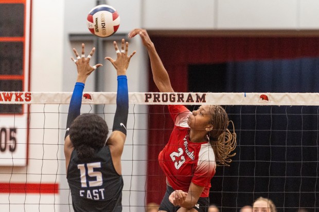 Marist's Cassidy Cage (23) powers the ball past Lincoln-Way East's Kyndal James (15) in the Class 4A Marist Sectional semifinals in Chicago on Tuesday, Nov. 5, 2024. (Vincent D. Johnson / for the Daily Southtown)