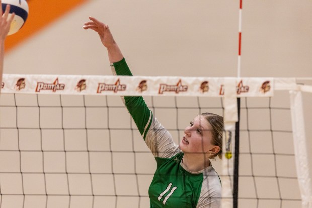 Providence's Abbey Knight (11) gets a kill against Limestone during the Class 3A Pontiac Supersectional in Pontiac on Monday, Nov. 11, 2024. (Vincent D. Johnson / for the Daily Southtown)