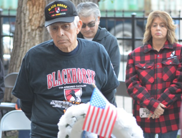 Tinley Park resident and Army veteran Fredric Arana reflects during a solemn moment at a wreath Nov. 7, 2024, at Leo High School in Chicago. (Jeff Vorva / for the Daily Southtown)