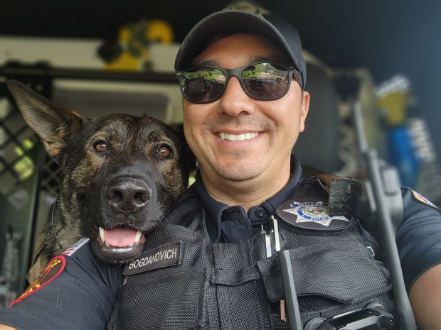 Officer Keith Bogdanovich in his squad car with K-9 Nicco. (Keith Bogdanovich)