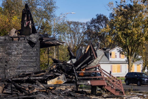 Four of the six houses damaged by fire Oct. 23 on the 1500 block of Lowe Avenue in Chicago Heights. (Vincent D. Johnson / for the Daily Southtown)