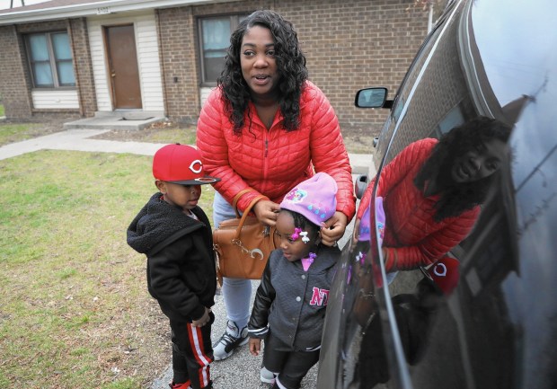 Shantel Allen gets daughter Samira and son Charles ready for a drive this month from their home in the West Calumet Housing Complex in East Chicago. Samira, 2, was recently found to have lead levels in her blood more that five times what the federal government says warrants intervention.