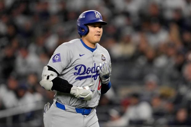 The Dodgers' Shohei Ohtani walks to the dugout after a popout against the Yankees during Game 3 of the World Series on Oct. 28, 2024, in New York. (AP Photo/Ashley Landis)