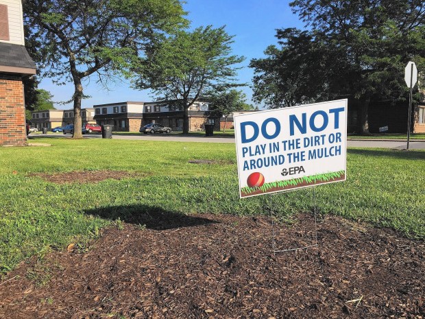 The Environmental Protection Agency has installed signs in the West Calumet Housing Development in East Chicago warning people to not play in the dirt or mulch due to elevated levels of lead in the ground in file photo. The housing development has since been razed.