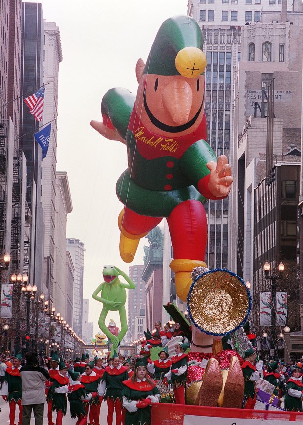 The Marshall Field's Jingle Elf makes its way up State Street with Kermit the Frog behind it during the Thanksgiving Day Parade on Nov. 25, 1999, in Chicago. (Phil Velasquez/Chicago Tribune)