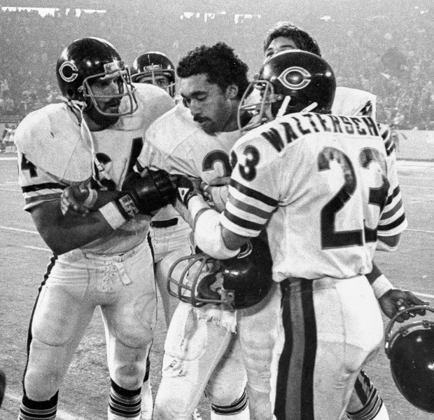 Bears Dave Williams is mobbed by teammates after returning the overtime kickoff for a touchdown and the victory over the Detroit Lions in Detroit on Thanksgiving Day, Nov. 27, 1980. (David Nystrom/Chicago Tribune)