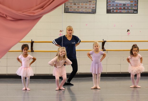 Bonnie Smith leads preschoolers Mira Taneja, from left, Charlotte Heerdt, Sadie Pogue and Anastasia Nastos during a dance class at the Joanne B. Wagner Community Center on Nov. 7, 2024, in Elmhurst. In Elmhurst, $90 million will pay to replace the Wagner Community Center and other local projects. (Stacey Wescott/Chicago Tribune)