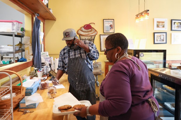 Lenore Lindsey and her son Vamarr Hunter work at their family-owned bakery on Nov. 13, 2024. (Eileen T. Meslar/Chicago Tribune)