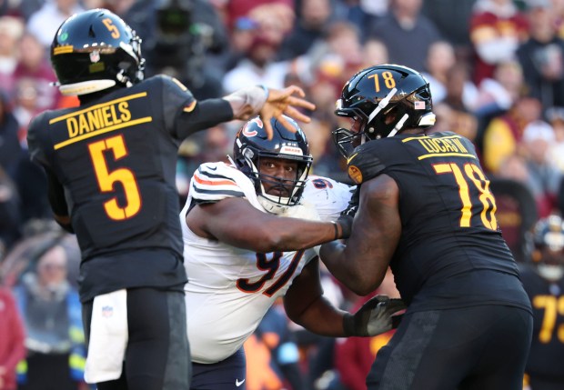 Bears defensive tackle Andrew Billings rushes Commanders quarterback Jayden Daniels on Oct. 27, 2024, in Landover, Md. (Brian Cassella/Chicago Tribune)