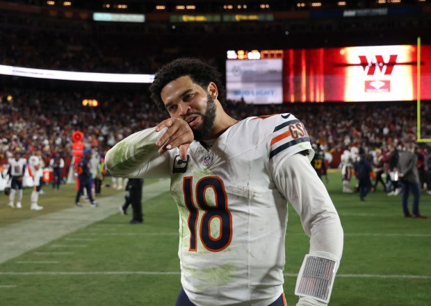 Chicago Bears quarterback Caleb Williams walks off after the loss against the Washington Commanders at Northwest Stadium. (Brian Cassella/Chicago Tribune)