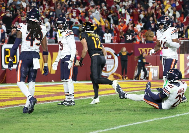 Chicago Bears cornerback Tyrique Stevenson (29) and the defense look at each other after Washington Commanders wide receiver Noah Brown caught a Hail Mary touchdown to win the game Sunday, Oct. 27, 2024, at Northwest Stadium in Landover, Maryland. (Brian Cassella/Chicago Tribune)