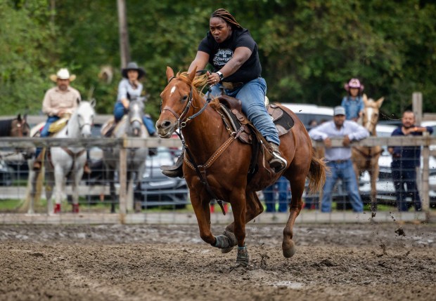 A rider competes in junior barrels at the 9th Annual Rodeo at Brown Family Ranch in Gary on Sept. 28, 2024. (Tess Crowley/Chicago Tribune)