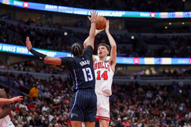 Chicago Bulls forward Matas Buzelis (14) takes a shot over Orlando Magic guard Jett Howard (13) during the second quarter at the United Center Wednesday Oct. 30, 2024, in Chicago. (Armando L. Sanchez/Chicago Tribune)