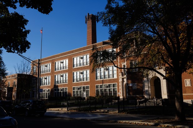 The sun sets after school lets out at William J. Onahan Elementary School on Nov. 11, 2024. (Armando L. Sanchez/Chicago Tribune)