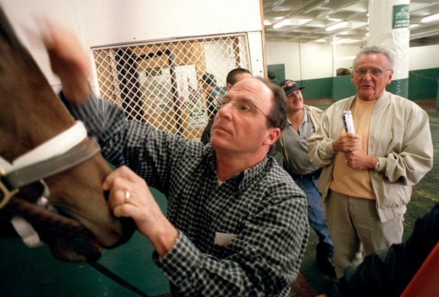 Thoroughbred owner Frank Calabrese, far right, with longtime trainer Wayne Catalano in 2002 at Hawthorne Race Course. (Anthony Robert La Penna/for the Chicago Tribune)