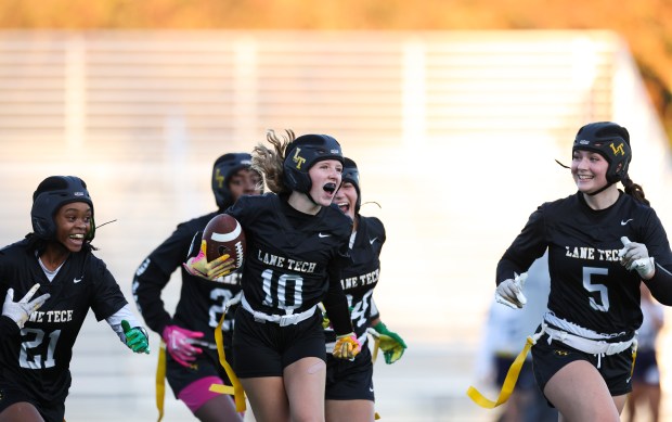 Lane Tech's Lila Massey, 10, celebrates with her teammates as she scores the game-winning touchdown in overtime in the sectional championship game against Jones College Prep at Winnemac Stadium on Oct. 16, 2024. (Eileen T. Meslar/Chicago Tribune)